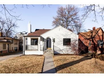 Charming remodeled home with a white brick exterior, landscaping, and a walkway at 2809 Forest St, Denver, CO 80207