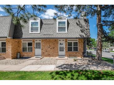 Charming townhomes with well maintained brick facade and beautiful landscaping at 1537 S Owens St # 31, Denver, CO 80232