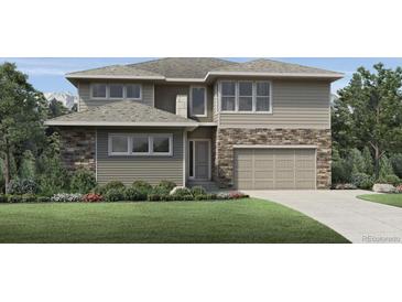 Charming two-story home with stone accents, a well-manicured lawn, and an attached two-car garage at 5762 Las Rosas Dr, Parker, CO 80134