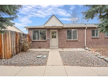 Charming brick home with a well-maintained front yard and inviting entrance at 2545 W 45Th Ave, Denver, CO 80211