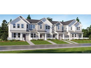 Charming townhome exterior featuring modern architecture and inviting curb appeal with manicured landscaping at 2002 S Haleyville Way, Aurora, CO 80018