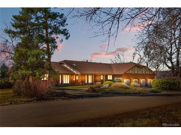 Charming single Gathering home with mature trees, and attached three car garage at 6980 Oak St, Arvada, CO 80004