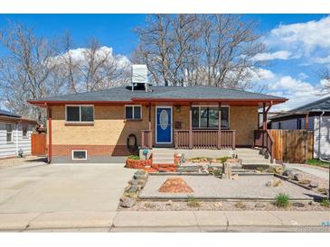 Charming brick home featuring a covered front porch and a low maintenance xeriscaped front yard at 2060 S Lowell Blvd, Denver, CO 80219