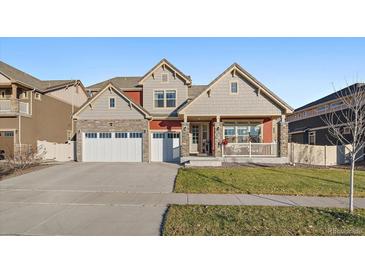 Beautiful two-story home with a two-car garage and covered porch at 315 Painted Horse Way, Erie, CO 80516