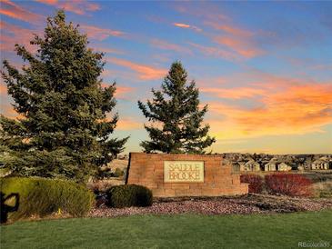 Saddle Brooke community entrance sign at sunset at 2111 Enterprise St, Superior, CO 80027