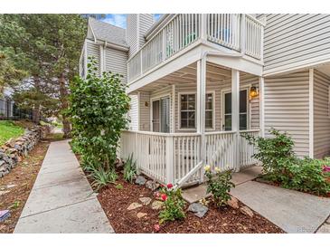 Charming condo with covered porch and a nicely landscaped yard at 12655 E Pacific Cir # E, Aurora, CO 80014
