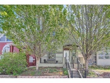 Charming two-story home with a cozy front porch and well-maintained landscaping at 2530 N Franklin St, Denver, CO 80205