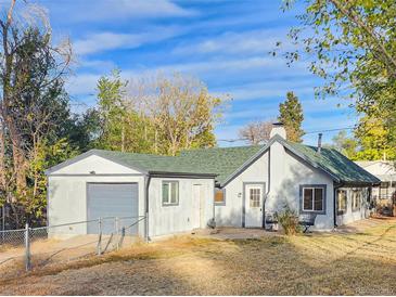 Charming single story home with attached garage and spacious yard at 274 S Newton St, Denver, CO 80219