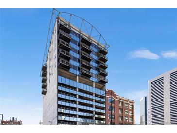 Contemporary condominium exterior showcases modern architectural design against a clear blue sky at 2020 Arapahoe St # 1130, Denver, CO 80205