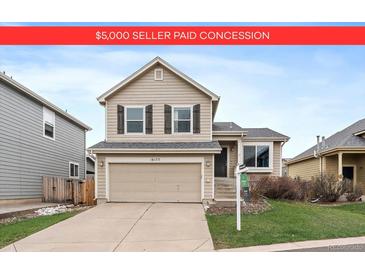 Charming two-story home features a two-car garage and well-maintained front yard at 16175 Peregrine Dr, Parker, CO 80134