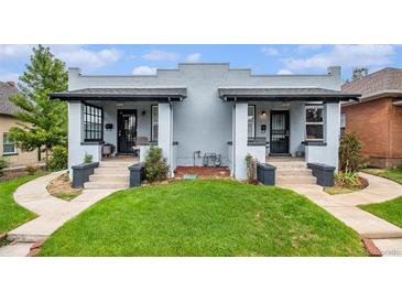 Charming bungalow with inviting front porch and well-manicured lawn at 3764 N Raleigh St, Denver, CO 80212