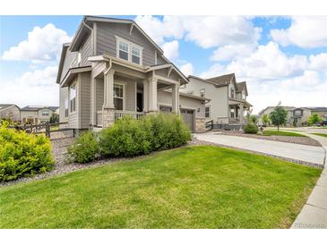 Charming two-story home with landscaped front yard and welcoming covered porch at 4884 St Vrain Rd, Firestone, CO 80504