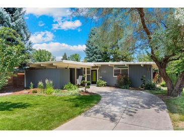 Charming single-story home with a well-manicured lawn, mature trees, and a curved driveway leading to the entrance at 1338 S Fairfax St, Denver, CO 80222