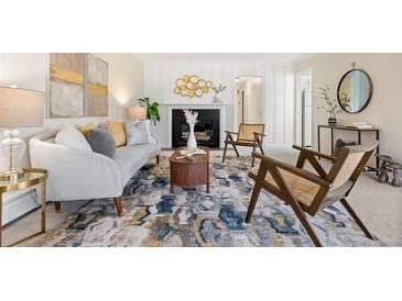 Bright living room featuring a decorative fireplace and modern furnishings at 3942 E Evans Ave, Denver, CO 80210