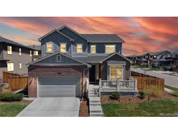 Charming two-story home with a brick and siding exterior, complemented by a well-maintained front yard at 12828 Fox Ct, Westminster, CO 80234