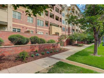 Brick building exterior with landscaping and sidewalk at 2200 S University Blvd # 201, Denver, CO 80210