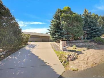 Lovely single Gathering home on a well-manicured lot featuring mature landscaping at 7292 Firethorn, Littleton, CO 80125