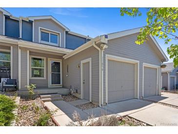 Inviting home with a two-car garage, featuring neutral siding and well-maintained landscaping at 11050 Gaylord St, Northglenn, CO 80233