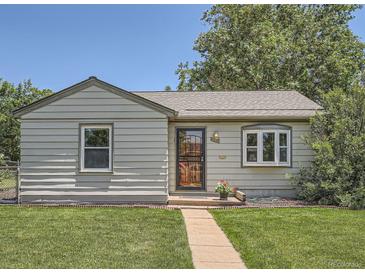 Charming home featuring a well-maintained lawn and inviting curb appeal at 1140 S Xavier St, Denver, CO 80219