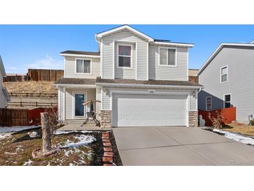 Charming two-story home featuring vinyl siding, a two-car garage, and well-maintained landscaping at 7745 Grant St, Denver, CO 80229