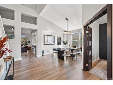Open concept dining room, seamlessly connected to living spaces, filled with natural light at 1053 Snow Lily Ct, Castle Pines, CO 80108