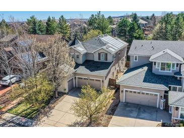 Charming two-story home with a three-car garage, solar panels and mature landscaping at 10908 Oakshire Ave, Highlands Ranch, CO 80126