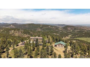Breathtaking mountain home with separate garage and private location at 13007 Kuehster Rd, Littleton, CO 80127
