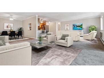 Spacious living room with adjacent dining area and kitchen at 605 S Alton Way # 9C, Denver, CO 80247