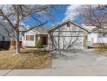 Charming single-Gathering home with a two-car garage and a well-manicured front yard in a quiet neighborhood at 22815 E Progress Ave, Aurora, CO 80015