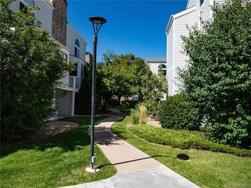 Well-manicured path meanders through a landscaped community at 11105 E Alameda Ave # 202, Aurora, CO 80012