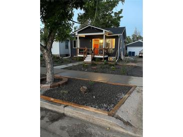 Charming craftsman style home with landscaping and a welcoming front porch at 3736 S Lincoln St, Englewood, CO 80113