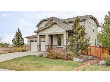Charming two-story home featuring a well-maintained lawn and inviting front porch at 500 176Th Ave, Broomfield, CO 80023