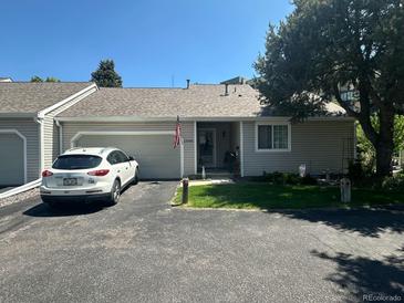 Charming home with attached garage, manicured lawn, and inviting curb appeal in a desirable neighborhood at 13908 E Linvale Pl, Aurora, CO 80014