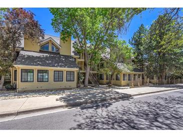 Inviting multi-level condo with classic design and mature trees offering shade and curb appeal at 980 S Dahlia St # F, Denver, CO 80246