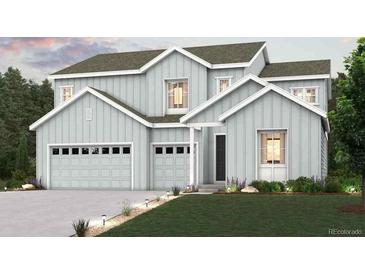 Charming two-story home with light-gray exterior, multi-car garage, and well-manicured lawn at 2500 Lupton Ln, Lafayette, CO 80026