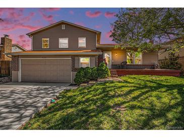Beautiful home with well-kept lawn, two-car garage, brick details, and a cozy front porch at 6132 W 113Th Ave, Westminster, CO 80020