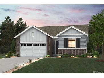 Charming, single-story home features a brick and siding exterior and well-manicured landscaping at 1321 Loraine N Cir, Lafayette, CO 80026