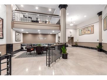 A stylish building lobby featuring a seating area, sleek finishes, and lofted space at 720 16Th St # 207, Denver, CO 80202