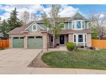Charming two-story home featuring a three-car garage and well-maintained landscaping at 10059 Granite Hill Dr, Parker, CO 80134