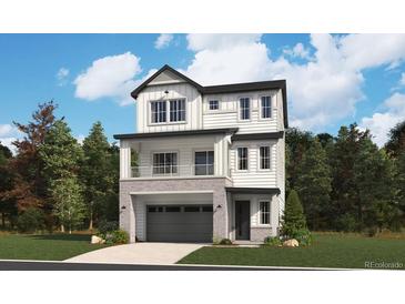 Charming two-story home boasting stylish architecture, a covered entry, and an attached two-car garage at 8376 Cokedale Dr, Littleton, CO 80125