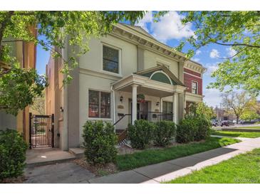 Charming home with classic architectural details, inviting porch, and well-maintained landscaping at 1580 N Franklin St, Denver, CO 80218