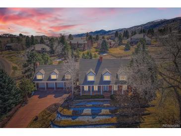 Expansive home with meticulous landscaping, four-car garage and mountain views at 19 Red Fox Ln, Littleton, CO 80127