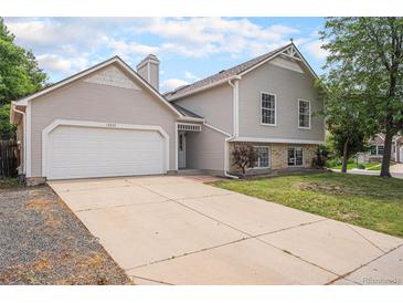 Charming two-story home with a spacious driveway and a well-maintained front yard at 12632 James Ct, Broomfield, CO 80020