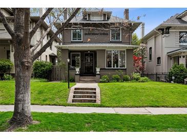 Charming two-story home with landscaped front yard, inviting curb appeal, and classic architectural details at 758 N Franklin St, Denver, CO 80218