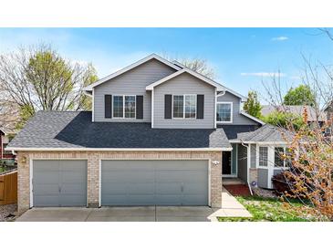 Charming two-story home featuring a three-car garage, neutral siding, and a well-maintained front yard at 2314 Flagstaff Dr, Longmont, CO 80504