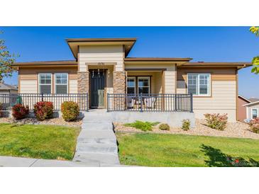 Beautiful ranch home with stone accents and a covered porch at 10761 N Montane Dr, Broomfield, CO 80021