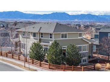 Inviting two-story home with wood fence and mountain view, providing a blend of comfort and natural beauty at 3925 W 149Th Ave, Broomfield, CO 80023