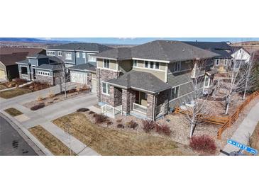 Charming two-story home with a stone facade, covered porch, landscaped yard and a two car garage at 3925 W 149Th Ave, Broomfield, CO 80023