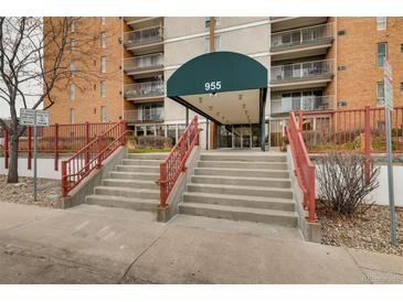 Inviting building entrance with grand steps and well-maintained landscaping, offering easy access to the property at 955 Eudora St # 1107, Denver, CO 80220