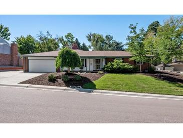 Ranch style home with landscaped yard and attached two-car garage at 3792 E Briarwood Ave, Centennial, CO 80122